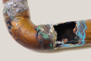 copper pipe with water damage