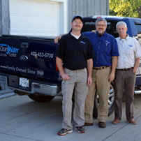 owners in front of water treatment truck