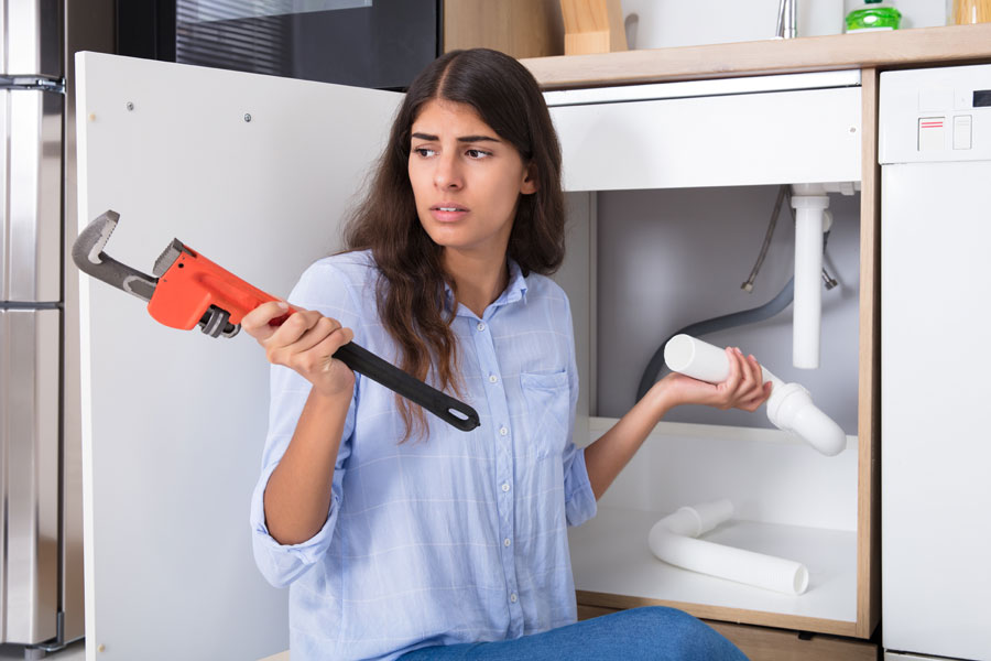 woman fixing water treatment issue