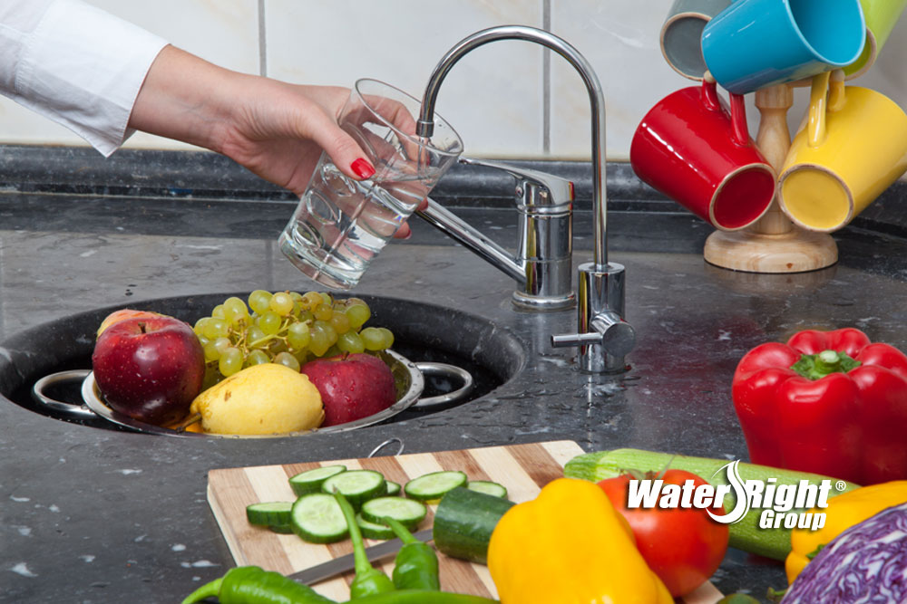 woman using RO water system