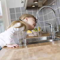 lead in water concerns girl drinking out of faucet